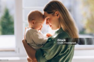 The profound connection between a loving mother and her baby, a serene snapshot of the beauty and tenderness of motherhood.